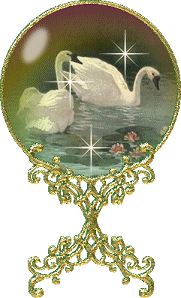 a snow globe with sparkles. there are two swans in a lake
